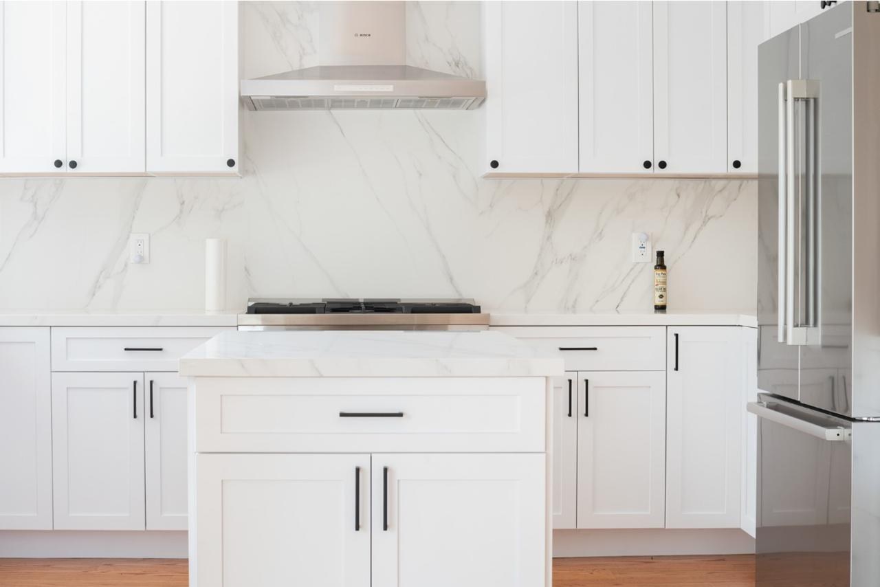 Kitchen: white shaker cabinets with marble slab backsplash with marble or quartz slab backsplash and white shaker cabinetry, by ASL Remodeling.