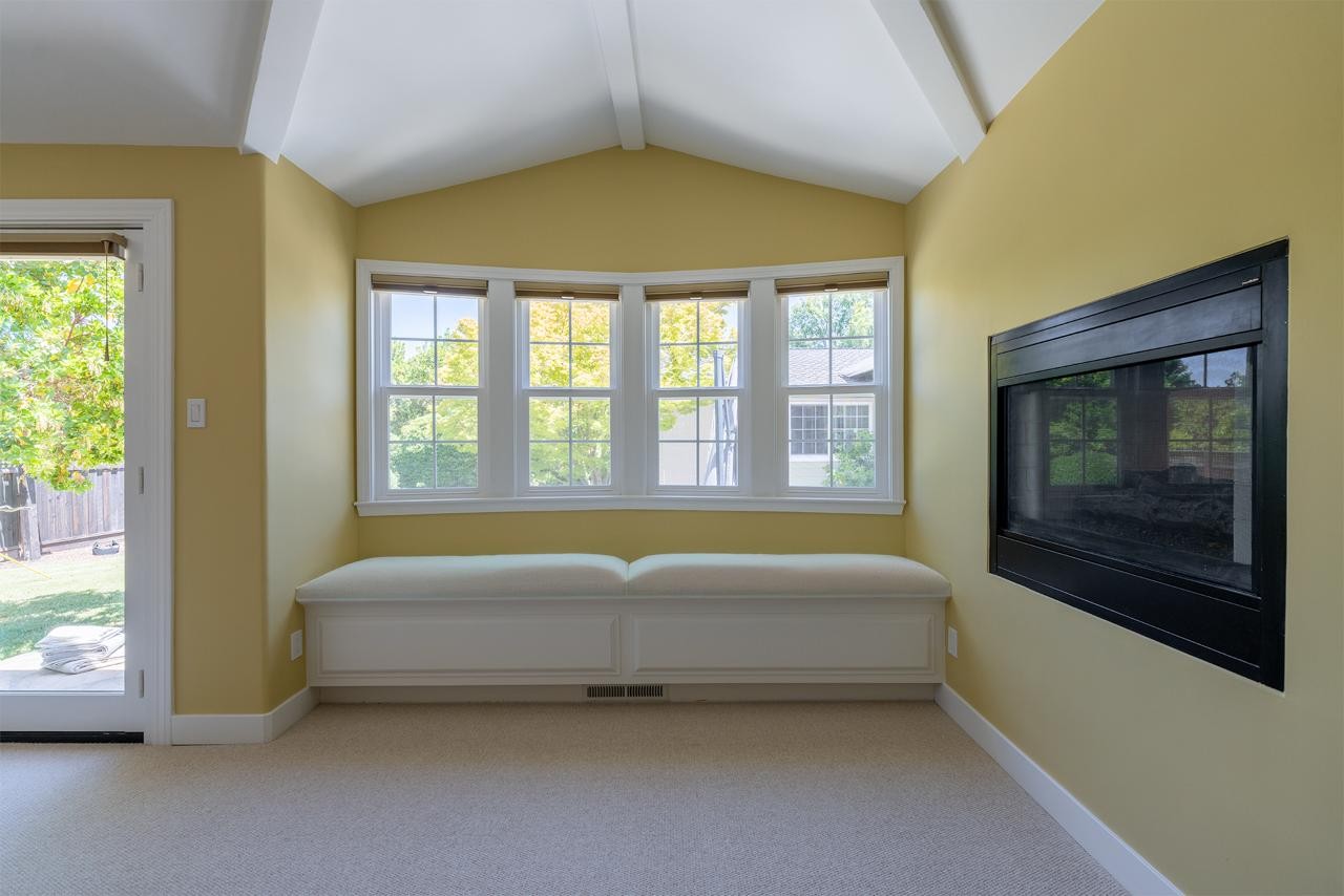 Master suite sitting area with custom built-in millwork