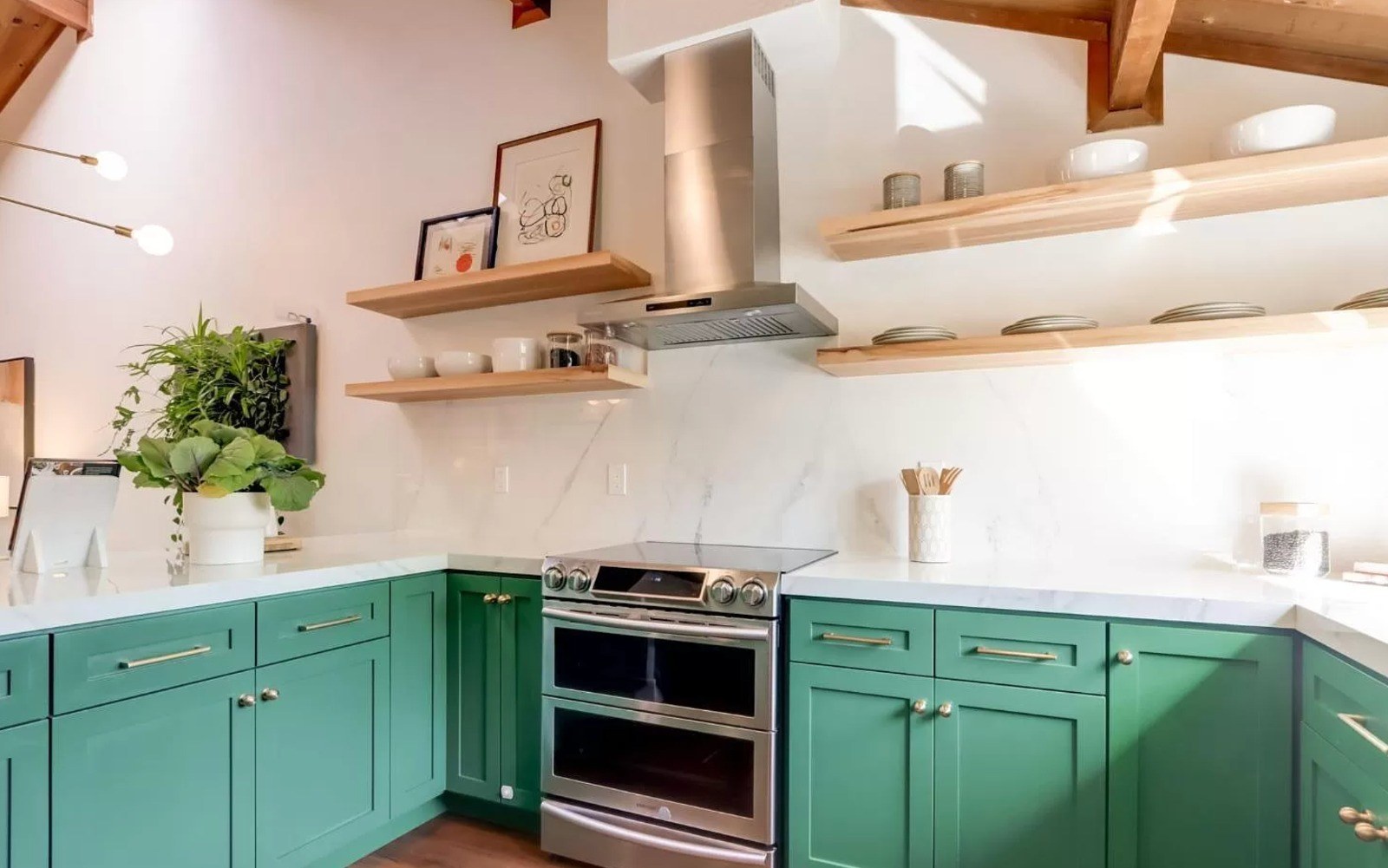 Kitchen with custom green maple cabinetry, open wood shelving, porcelain slabs, and wood ceiling with exposed beams