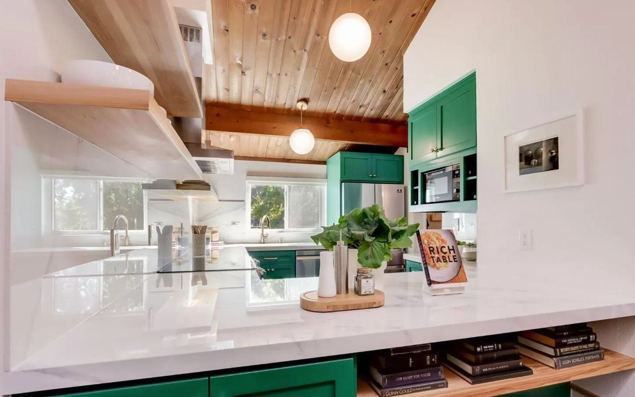 Kitchen featuring custom green maple cabinetry, wood ceiling with exposed beams, and open shelving storage